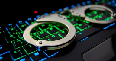 A colorful keyboard and handcuffs.
