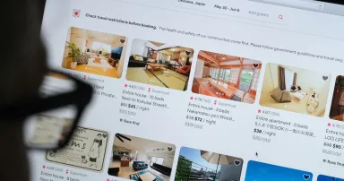 <p>A man looks at the website of Airbnb in Katwijk, Netherlands. Cloudflare introduced an analytics platform similar to Google’s but which does  not track visitors to websites. (Photo by Yuriko Nakao/Getty Images)</p>
