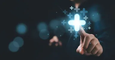 Businessman touching to plus sign mark for value added , It is symbol of  business profit growth , health insurance , benefit and economy development concept.