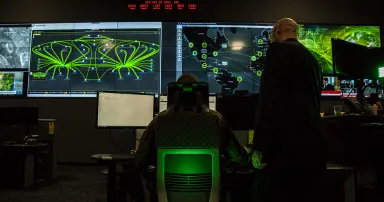 Cybersecurity personnel work in a cyber operations center