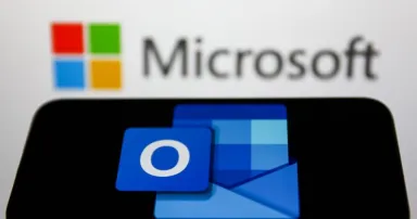 <p>Microsoft Outlook logo displayed on a phone screen and Microsoft logo displayed on a screen in the background are seen in this illustration photo taken in Krakow, Poland on May 26, 2022. (Photo Illustration by Jakub Porzycki/NurPhoto via Getty Images)</p>
