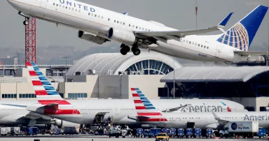 <p>A United Airlines plane takes off at Los Angeles International Airport (LAX) on October 1, 2020 in Los Angeles, California. LAX was among the airports that saw their websites go down as a result of a DDoS attack Monday. (Photo by Mario Tama/Getty Images)</p>