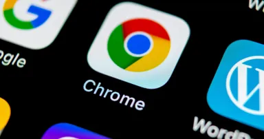 Google Chrome application icon on Apple iPhone X screen close-up. Google Chrome app icon.