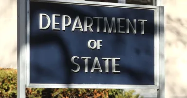 A sign identifies the State Department.