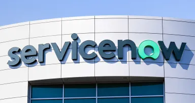 ServiceNow logo is seen on the side of a building.