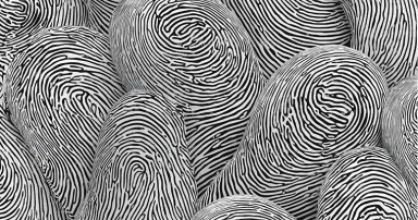 A detailed close up of multiple fingerprints in black and white