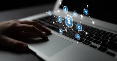 <p>This image captures a modern workspace where digital security is highlighted, featuring a hand on a laptop keyboard with security icons representing connectivity and protection. Tessel</p>
