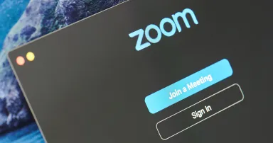 Sign in Zoom app on laptop screen close up view