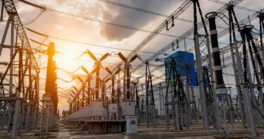 <p>High voltage substation under sunset. The Department of Energy is putting $12 million behind six university-led cybersecurity research projects that look for innovative ways to securely build or design the nation’s energy systems. (Photo Credit: bjdlzx via Getty Images)</p>