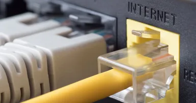 Network cables connected to a router or modem