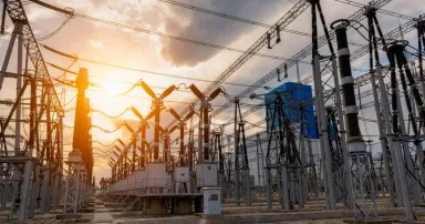 <p>High voltage substation under sunset. The Department of Energy is putting $12 million behind six university-led cybersecurity research projects that look for innovative ways to securely build or design the nation’s energy systems. (Photo Credit: bjdlzx via Getty Images)</p>