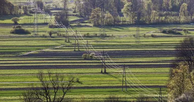 High power electricity poles in a field