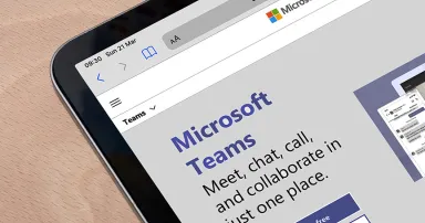 Microsoft Teams website on a tablet. Teams is a unified team communication and collaboration platform with workplace chat, video meetings, and file storage.