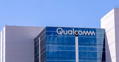 Sign and logo of Qualcomm company on a side of a building.