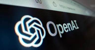 A close-up view of OpenAI logo on its website.