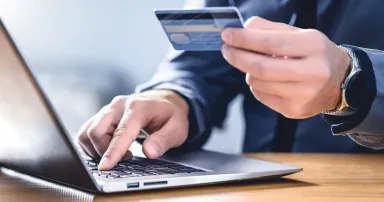 <p>Safe online payment and electronic money transfer security. Pay with digital technology. Man using credit card and laptop to login to internet bank. Financial safety to prevent scam, threat and fraud.</p>