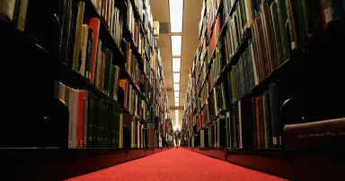 <p>A man browses through books at the Cecil H. Green on the Stanford University Campus Dec. 17, 2004, in Stanford, Calif. (Photo by Justin Sullivan/Getty Images)</p>
