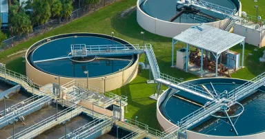 Aerial view of water treatment factory at city wastewater cleaning facility. Purification process of removing undesirable chemicals, suspended solids and gases from contaminated liquid.