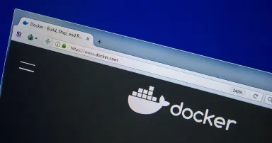 The Docker website is displayed on a computer.