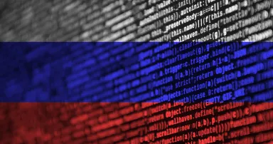 Russia flag is depicted on the screen with the program code. The concept of modern technology and site development.