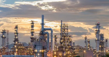 Oil refinery plant from industry zone, Aerial view oil and gas industrial, Refinery factory oil storage tank and pipeline steel at night.
