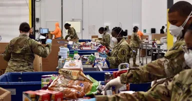 <p>U.S. soldiers support operations at the Atlanta Community Food Bank in April 2020. Food banks are one of many nonprofit organizations threatened by cybercriminal activity. (U.S. Army National Guard photo by Major Charles W. Westrip. “File:Food bank support (49743030266).jpg” by Georgia National Guard from United States is licensed under CC BY 2.0)</p>