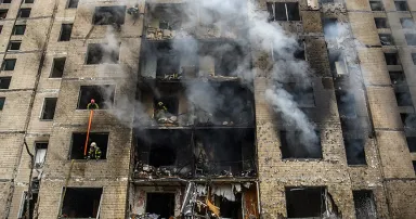 Firefighters are working at the site of a residential building that was heavily damaged during a Russian missile attack this morning in Kyiv, Ukraine, on January 2, 2024.