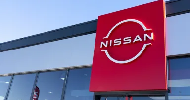 Nissan logo brand and text sign for dealership store of Japanese car shop