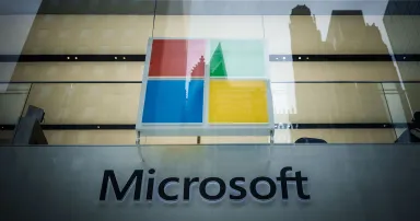 The Microsoft logo is displayed on the outside of a building.