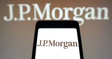 The JPMorgan logo is displayed on a smartphone screen and in the background