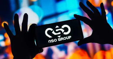 The NSO Group Technologies logo is seen displayed on a smartphone