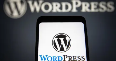 <p>UKRAINE &#8211; 2021/11/22: In this photo illustration, the WordPress (WP, WordPress.org) logo is seen on a smartphone and in the background. (Photo Illustration by Pavlo Gonchar/SOPA Images/LightRocket via Getty Images)</p>
