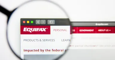 Equifax website homepage. Equifax logo visible on display screen