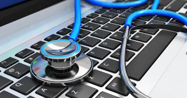 Stethoscope on laptop keyboard