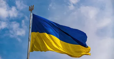 Ukrainian national official flag on blue sky background