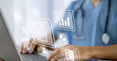 Doctor using computer checking data patient document