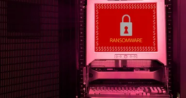Ransomware attack alert on monitor screen in data center, network security concept