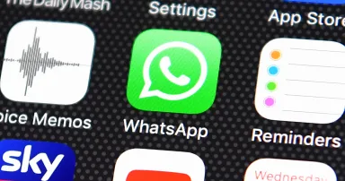 <p>The Whatsapp app logo is displayed on an iPhone on Aug. 3, 2016, in London. (Photo by Carl Court/Getty Images)</p>