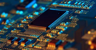 Electronic circuit board with electronic components such as chips close up.