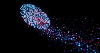 Abstract shattered fingerprint icon disintegrating into digital particles on a dark background, representing data security and identity theft