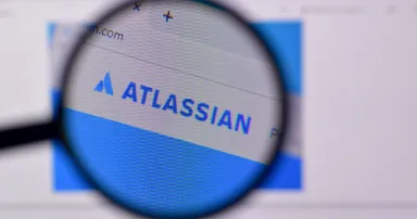 Homepage of atlassian website on the display of PC, url - atlassian.com.