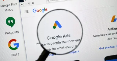 The Google Ads logo and app on a home page.