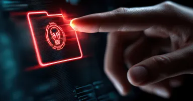 Cyber threat conceptual visualization of a digital folder with a skull icon representing a computer virus on a digital screen