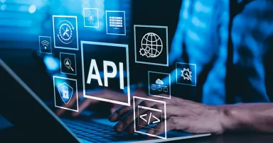 API Application Programming Interface Concept. A programmer types on a laptop, interacting with digital icons representing API development, security, and cloud computing. Application Software Tool,