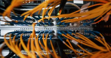 Close up view of internet equipment and cables in the server room.