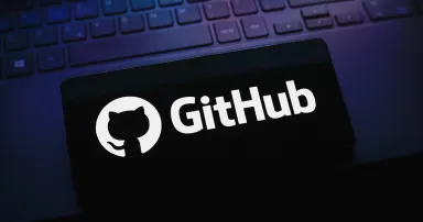 The GitHub logo is displayed on a smartphone screen
