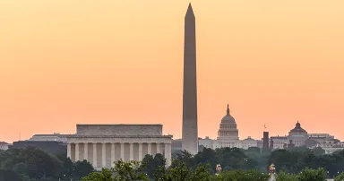 Dawn and sunrise over nations capital with all monuments aligned against orange sky