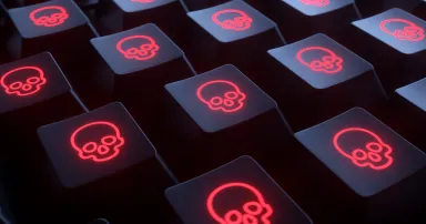 Closeup keyboard with skulls. Infected computer.