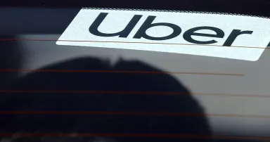 Uber sign in a car window