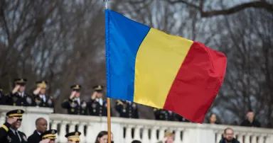 <p>Romanian police announced the arrest of members of the REvil ransomware group on Nov. 8. Pictured: The Romanian flag flies Feb. 7, 2017, during an armed forces ceremony at Fort Meyer, Va., Feb. 7, 2017. (Pfc. Gabriel Silva/US Army) </p>